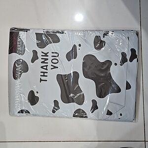 Ten 10x13 poly mailer in black & white cow print
